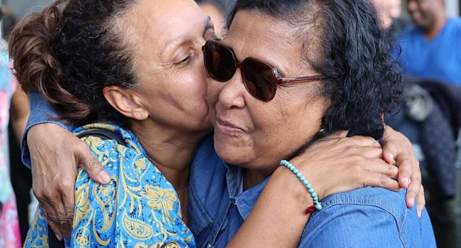 One of 47 people born on Runion Island and raised in Frances Creuse region is welcomed back to the island on 7 April 2023. France has approved a law granting reparations to children transferred from Runion Island to mainland France between 1962 and 1984. - AFP - STEPHAN