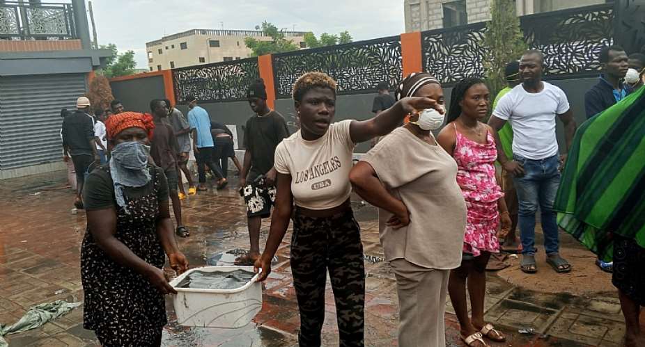 Swift response by Saki High Tension residents helpscontainwarehouse blaze inKponeKatamanso