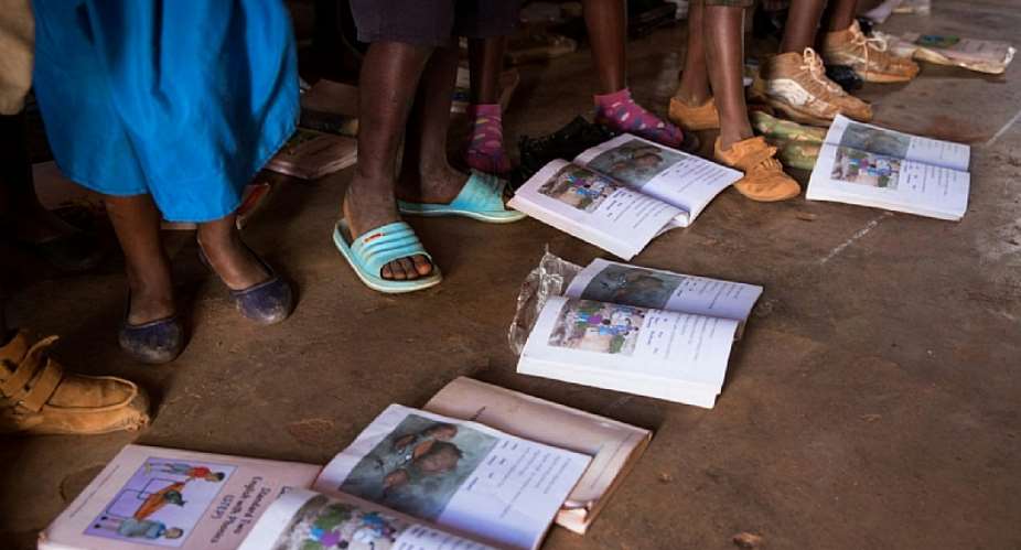 Students’ textbooks, provided by USAID, at a school in Malawi, 2016. - Source: By Lawrence Jackson, Wikimedia Commons