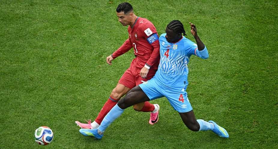 Portugals Cristiano Ronaldo in action with DR Congos Axel Tuanzebe during the 2026 World Cup Group K football match between Portugal and the Democratic Republic of Congo at the Houston Stadium in Houston on June 17, 2026. -  Annegret Hilse, Reuters