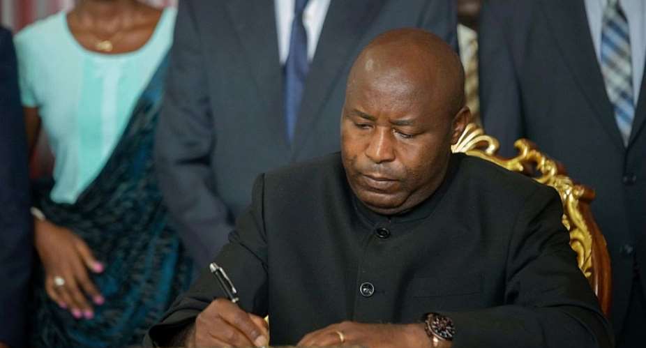 Burundi's president-elect Evariste Ndayishimiye signs a condolence book for Burundian president Pierre Nkurunziza.  - Source: (Photo by Evrard Ngendakumana/Xinhua via Getty)