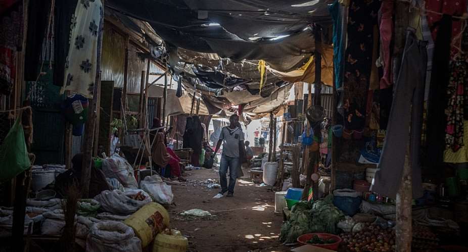 A man seen walking through a market in Dadaab refugee camp.  More than 200,000 refugees live there.  - Source: Sally HaydenSOPA ImagesLightRocket via Getty Images