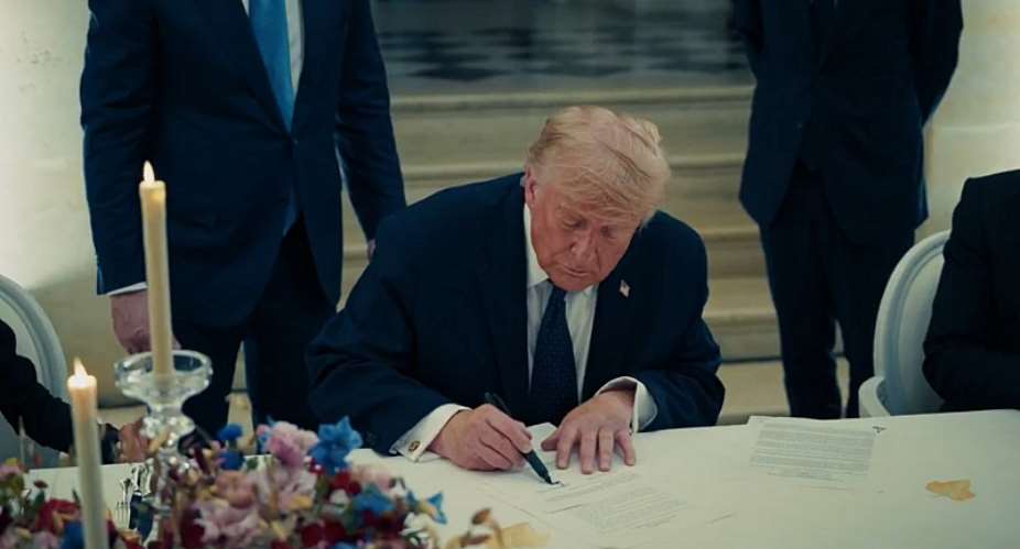This screenshot taken from a video released by the White House on June 18, 2026 shows US President Donald Trump  signing a copy of the US-Iran interim agreement at the Palace of Versailles in France. -  White House via X