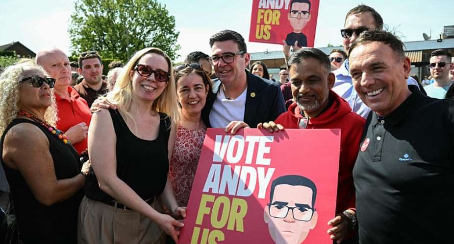 Andy Burnham, centre, is bidding to return to parliament after a nine-year absence. -  Paul ELLIS / AFP