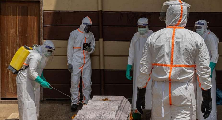 Health workers prepare the coffin of a university student who died of Ebola at the Citadelle Clinic in Bunia on June 12, 2026. -  Moses Sawasawa, AP