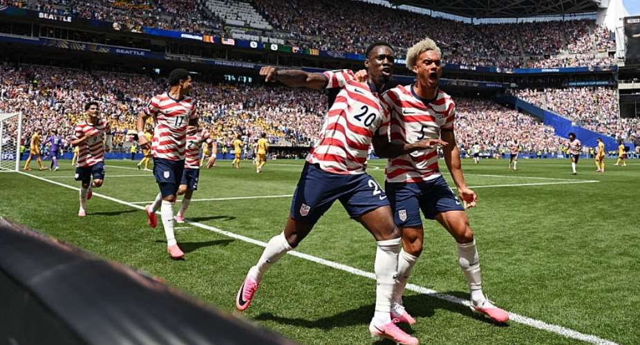 Folarin Balogun and Antonee Robinson of the US celebrate after the opening goal against Australia in Seattle. -  Troy Wayrynen, Reuters