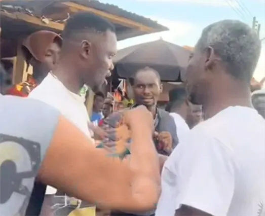 Agya Koo (right) trying to calm down the youth