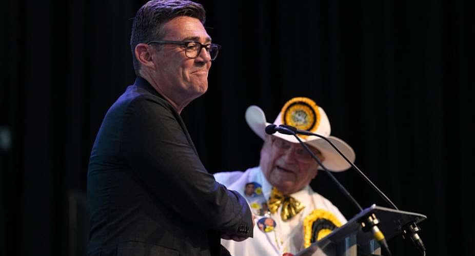 A member of the Loony Party watches as Labour partys Andy Burnham speaks after winning the Makerfield by-election, 19 June, 2026. - AP Photo/Jon Super - Jon Super