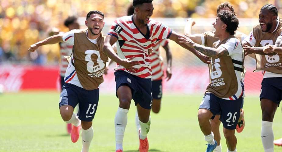 Alex Freeman celebrates with teammates after scoring the United States second goal against Australia. - Getty Images via AFP - JAMIE SQUIRE