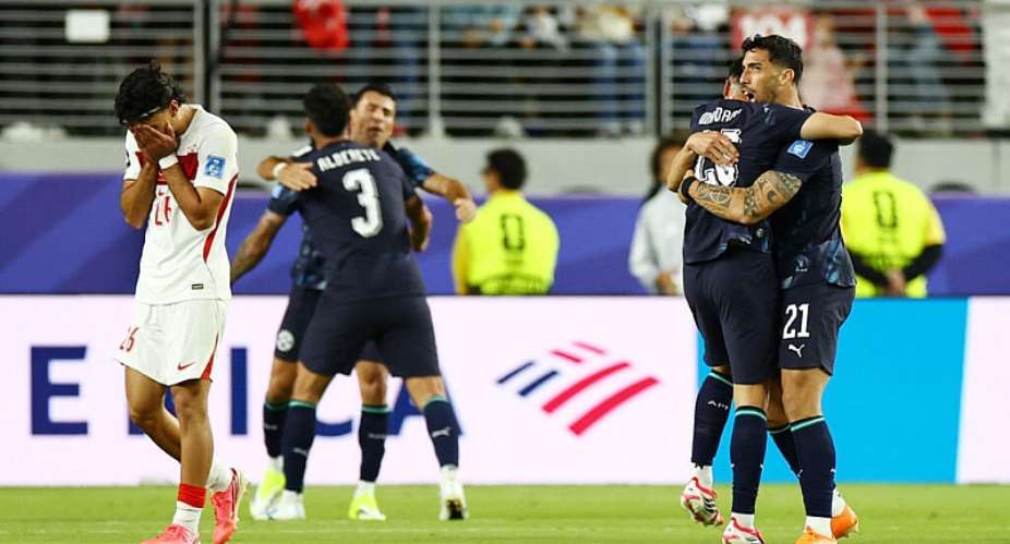 Paraguays Gabriel Avalos and teammates celebrate after the match as Turkeys Can Uzun looks dejected, June 19, 2026. -  Carlos Barria, Reuters