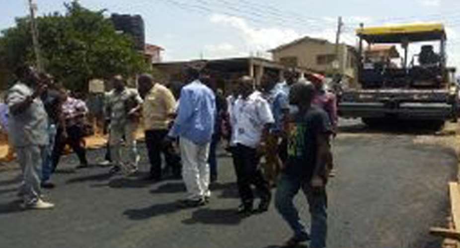 Sara Adwoa Safo and her team inspecting the road
