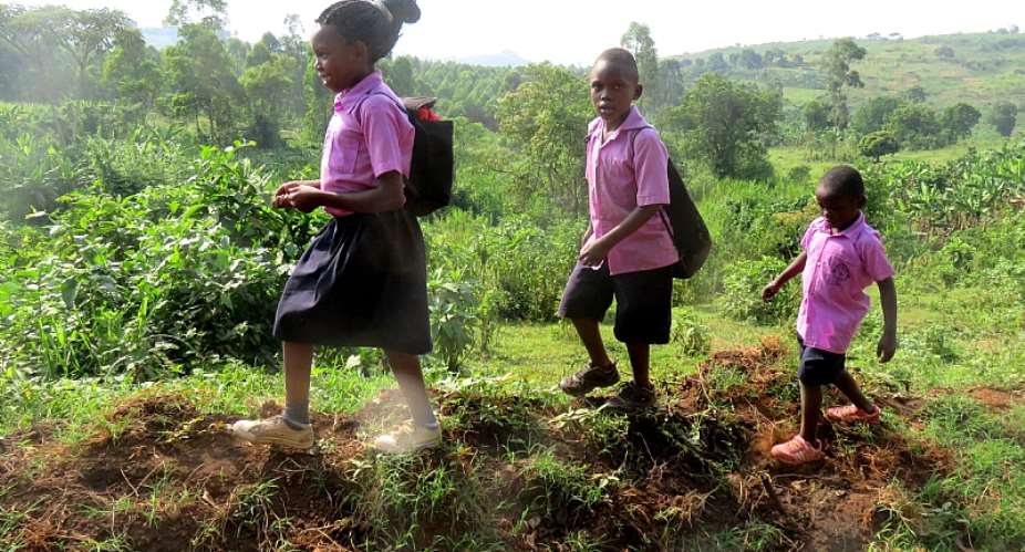 Children make their way to school in Fort Portal, Uganda. - Source: Shutterstock