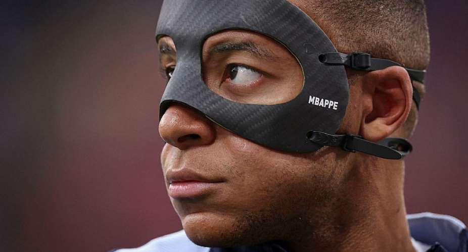 GETTY IMAGESImage caption: Kylian Mbappe broke his nose in a collision with Austrias Kevin Danso on Monday