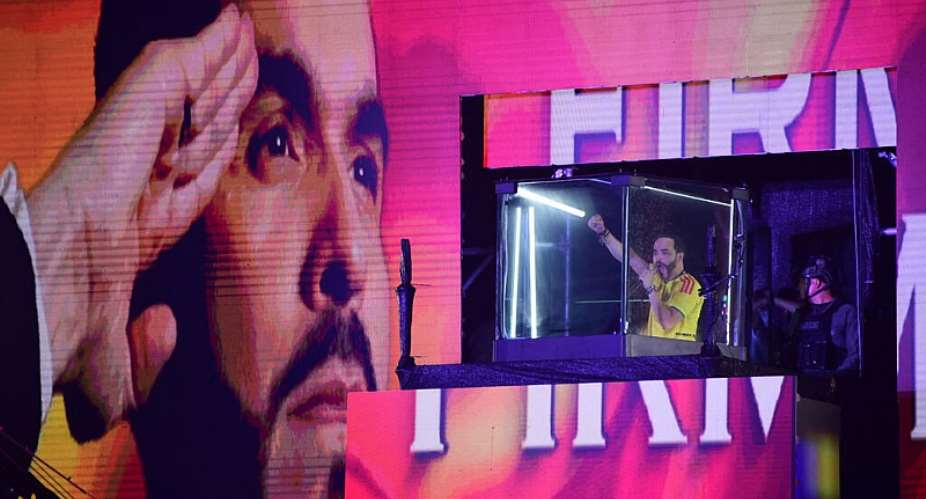 Colombias presidential candidate Abelardo de la Espriella is shown positioned behind bulletproof glass following the preliminary results of the presidential runoff election in Barranquilla, Colombia, June 21, 2026. -  Jaime Samdarriaga, AFP