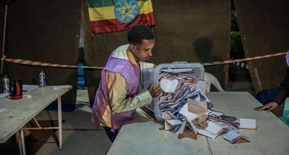 National Election Board of Ethiopia officials sort and count ballots at the Shalla Park polling station during the general election in Addis Ababa, Ethiopia, 2 June 2026.` -  Amanuel Sileshi/AP