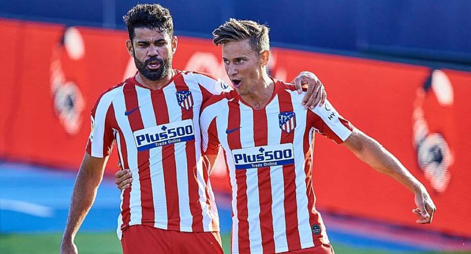 Marcos Llorente (R) of Atletico de Madrid and his teammate Diego Costa celebrate a goal during the Liga match between Levante UD and Club Atletico de Madrid at Estadio Camilo Cano on June 23, 2020 in Valencia, SpainImage credit: Getty Images