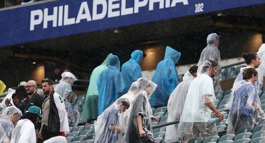 Fans wear raincoats at halftime of the 2026 World Cup Group I football match between France and Iraq at the Philadelphia Stadium on June 22, 2026. -  Franck Fife, AFP