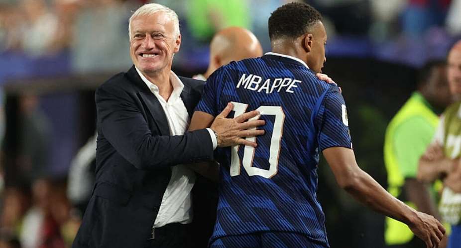 France coach Didier Deschamps embraces Kylian Mbappe as he leaves the pitch after being substituted -  Siphiwe Sibeko, Reuters