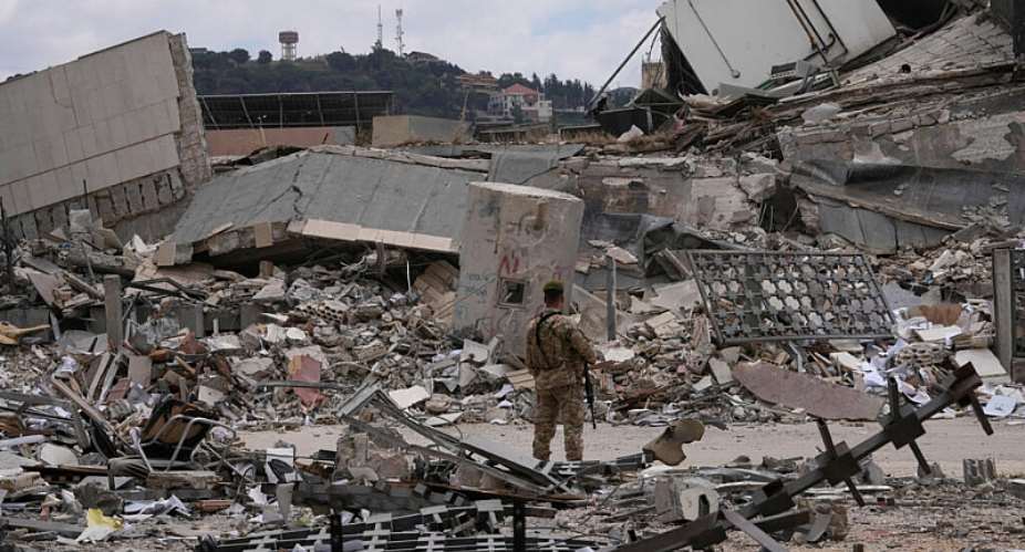A Lebanese soldier stands in front of a destroyed branch of the Lebanese Central Bank in the town of Nabatiyeh, southern Lebanon, on June 22, 2026. -  Mohammed Zaatari, AP