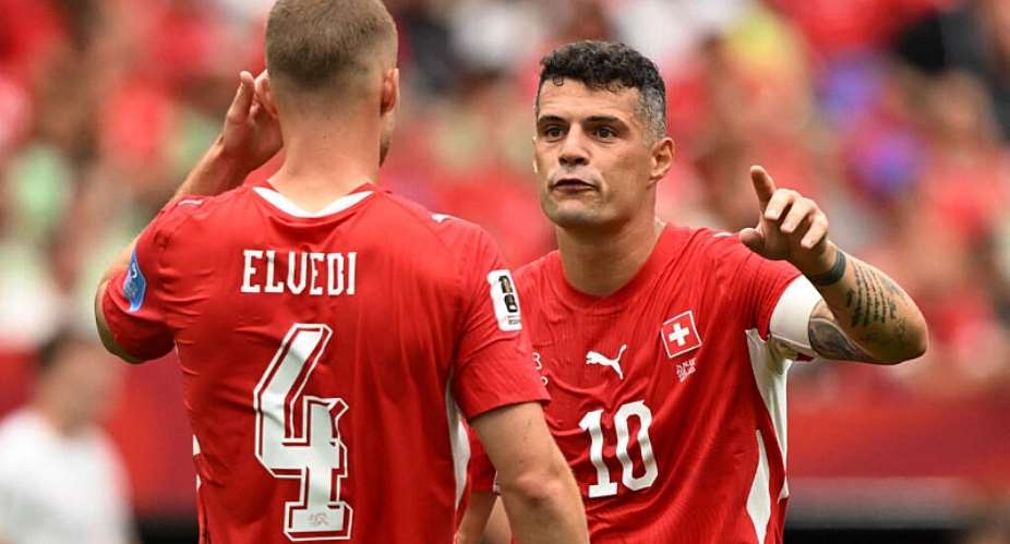 Switzerlands captain Granit Xhaka and defender Nico Elvedi react during an intense moment as Switzerland battle Canada in their decisive Group B encounter at BC Place. -  Anne-Marie Sorvin, Reuters