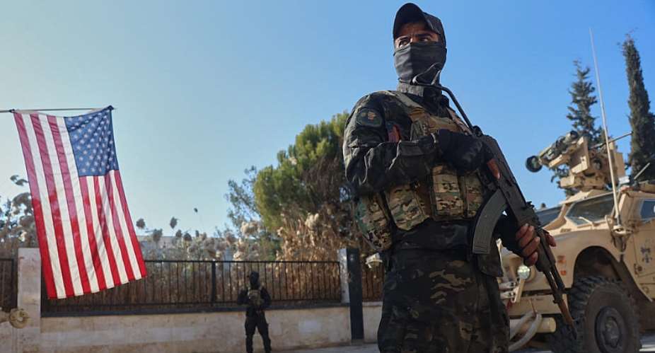 File photo: A fighter with the Syrian Democratic Forces (SDF) stands guard during a meeting with the US-led coalition against the Islamic State group in Deir Hafer, Syria on January 16, 2026. -  Baderkhan Ahmad, AP