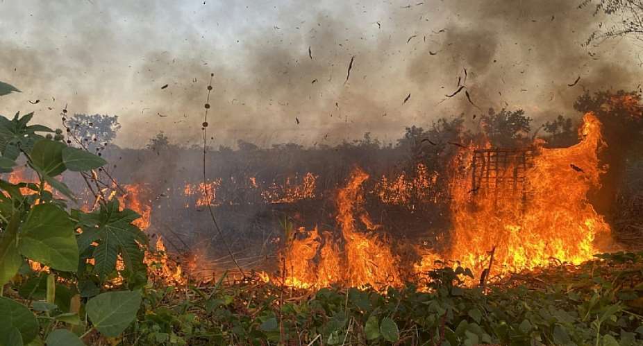 A controlled, preventive fire clears dry fuel near a village in eastern Angola. - Source: Luisa Escobar Alvarado