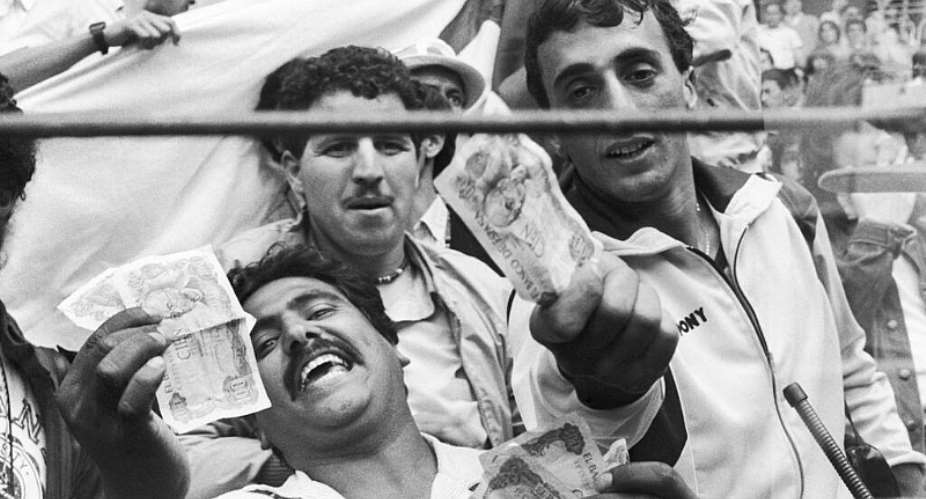 Algerian supporters show money to photographers after West Germany and Austria played out a mutually suitable scoreline in 1982s Disgrace of Gijon. -  AP file photo