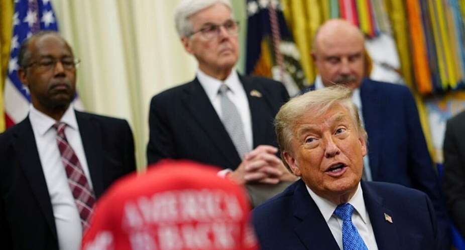 US President Donald Trump speaks as Ben Carson, Texas Lt. Gov. Dan Patrick and Phil McGraw listen in the Oval Office of the White House in Washington, DC on June 26, 2026. -  Julia Demaree Nikhinson, AP