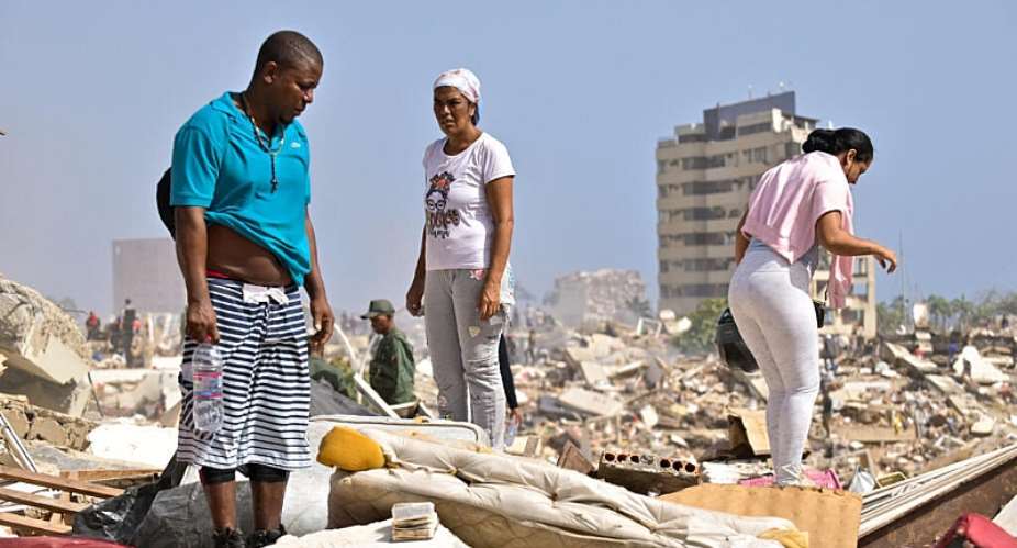 People search for victims amid the rubble of buildings that collapsed following the earthquakes that struck the country in La Guaira on June 26, 2026. -  Maxwell Briceno, Reuters