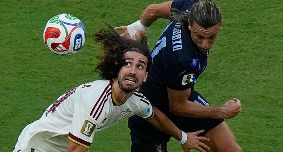 Spains Marc Cucurella battles for the ball with Uruguays Agustin Canobbio during the World Cup Group H soccer match between Uruguay and Spain in Mexico, June 26, 2026 -  Fernando Llano, AP