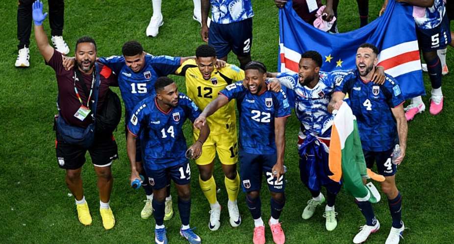 Cape Verde players celebrate with fans after advancing to the last 32 knockout stages at the World Cup on their debut appearance. - REUTERS - Annegret Hilse