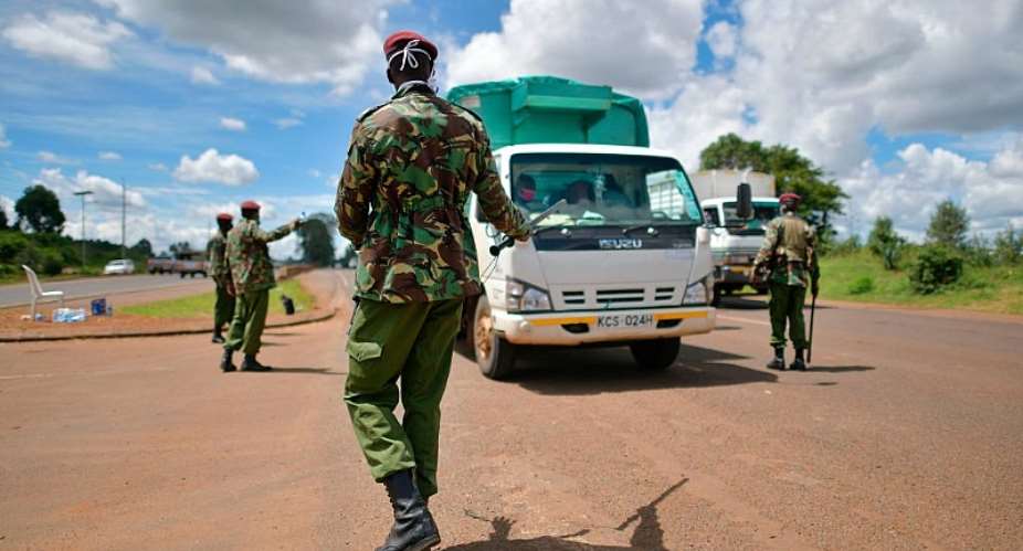 General Service Unit officers, part of Kenyaamp;39;s police service, stop a commercial vehicle at a checkpoint. - Source: Tony KarumbaAFP via Getty Images