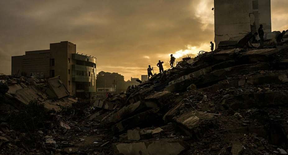 Men searching for survivors stand atop a mountain of rubble three days after twin earthquakes struck, in La Guaira, Venezuela, Saturday, June 27, 2026. -  Matias Delacroix, AP