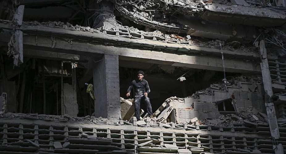 A man looks out from a damaged apartment building following an earthquake in Catia La Mar, La Guaira state, some 30km north-west of Caracas, on June 25, 2026. -  Frederico Parra, AFP