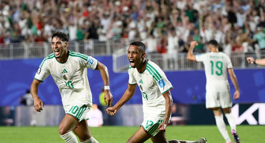 Algerias Rafik Belghali celebrates with his teammate Fares Chaibi after scoring his teams first goal during the World Cup Group J  match between Algeria and Austria in Kansas City, June 27,2026. -  Reed Hoffmann, AP
