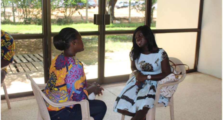 Gifty Bingley of Tigo Ghana Mentoring a participant at Barcamp Tema 2015