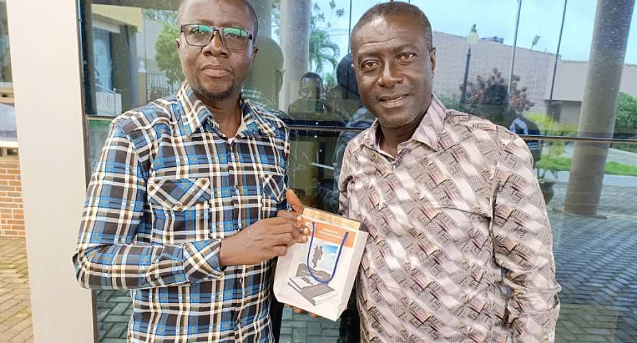Captain Smart receives copy of DC Kwame Kwakye's fatherhood book