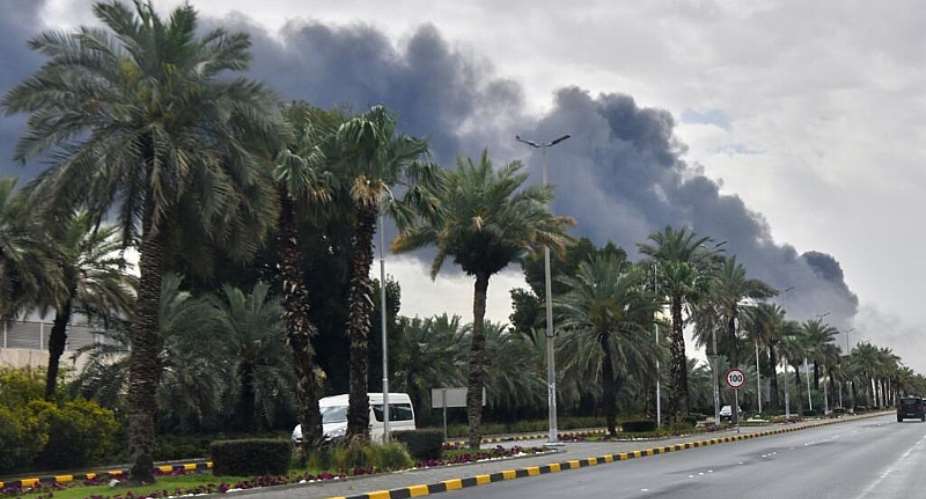 (FILE) Smoke rises from Kuwait international airport after a drone strike on fuel storage on March 25, 2026. - AP