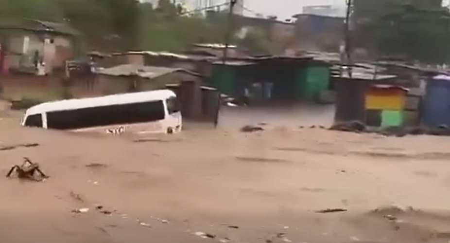 STC bus swept away by heavy floodwaters at Achimota–Abofu