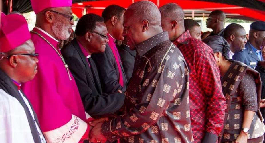 File photo: President John Mahama exchange pleasantries with some members of the clergy