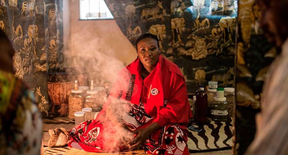 Traditional healer Gogo Phephisile Maseko attends to patients using a blend of cannabis and other herbs in Johannesburg AFPGetty