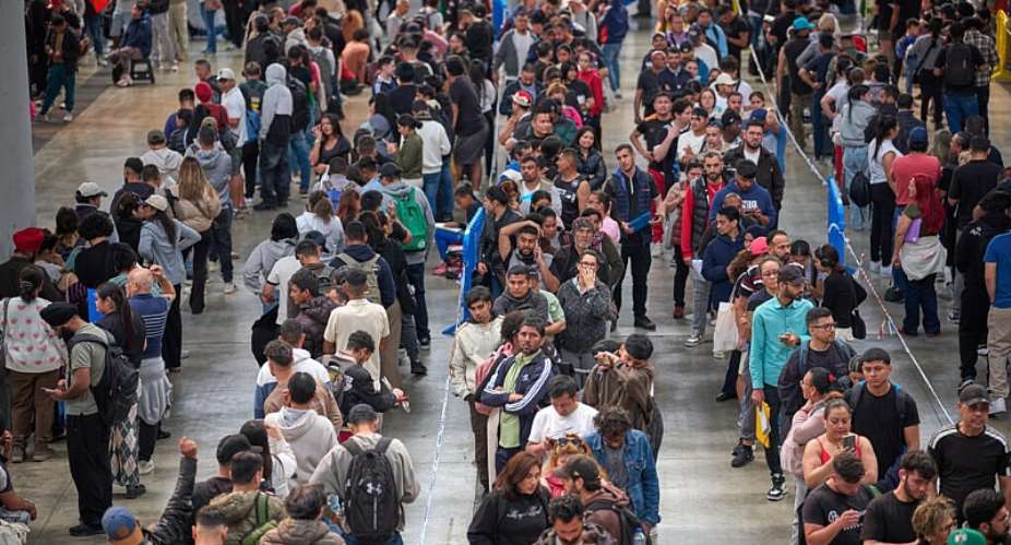 Migrants queue at a public service office to obtain paperwork needed to apply for Spains immigration amnesty near Barcelona on April 21, 2026. -  Emilio Morenatti, AP