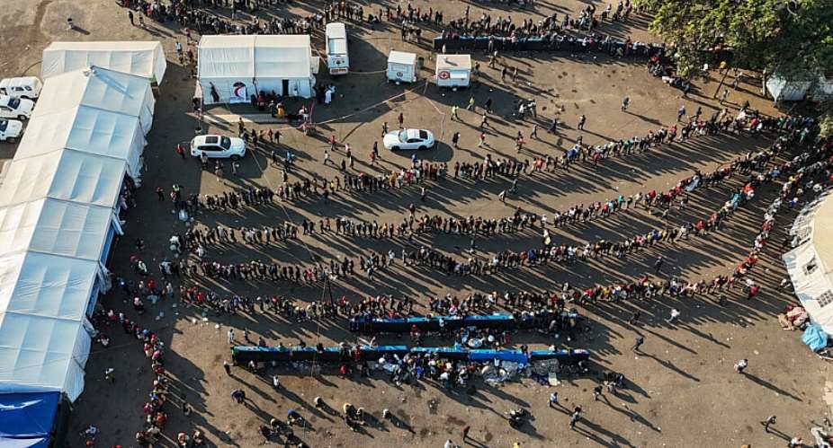 A drone view of thousands of Malawians at a Durban drive-in site amid fears of anti-immigrant violence ahead of a June 30 deadline set by activists demanding undocumented migrants leave the country, in Durban, South Africa, 25 June 2026. - REUTERS - Siyabonga Sishi
