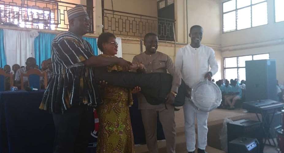 Municipal Education Director receives items from the Hon Benjamin Yeboah Sekyere