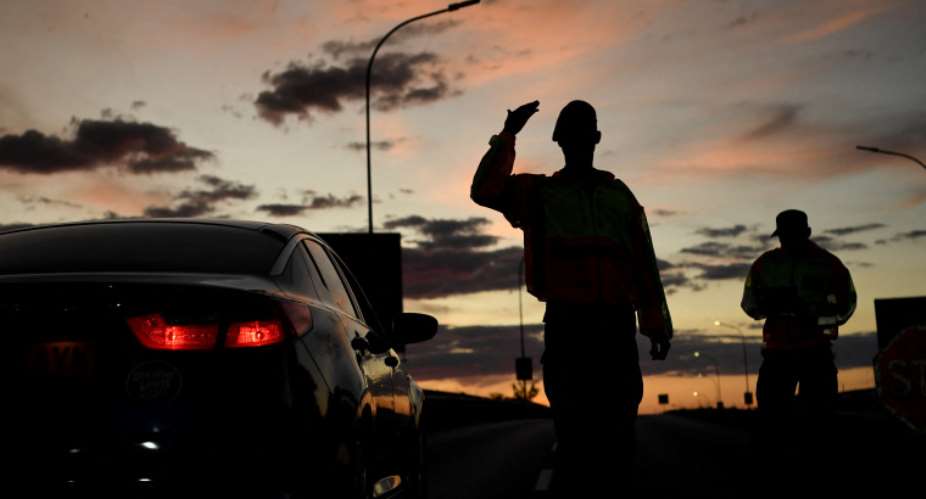 Military police check the travel permits of travelers at a roadblock in Gaborone, Botswana on April 5, 2020. Police in Botswana charged staff members at Moeladilotlhoko News Boiler with criminal trespass. AFPMonirul Bhuiyan