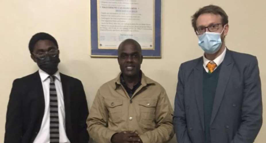 New York Times freelance journalist Jeffrey Moyo, flanked by his defense lawyers, Zangelo Mlilo left and Doug Coltart right, is seen in Bulawayo, Zimbabwe, on May 27, 2021. Photo: Doug Coltart
