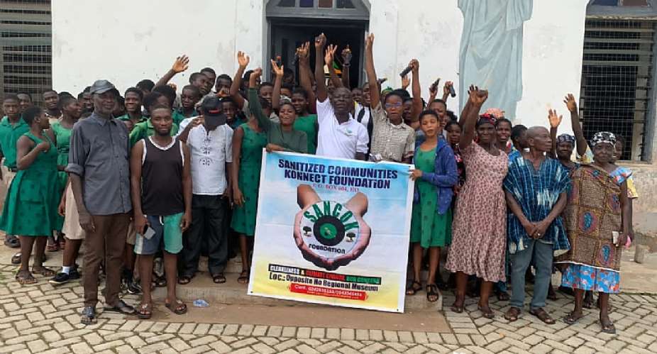 Student and Community member in pose after symposium at Abutia Kloe