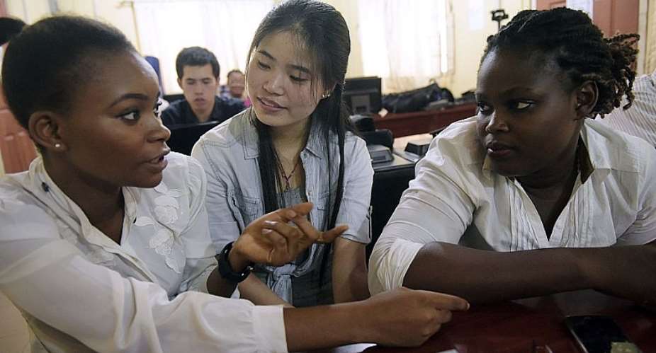 A Chinese language teacher speaks with students at the Confucius Institute at the University of Lagos. - Source: PIUS UTOMI EKPEIAFP via Getty Images