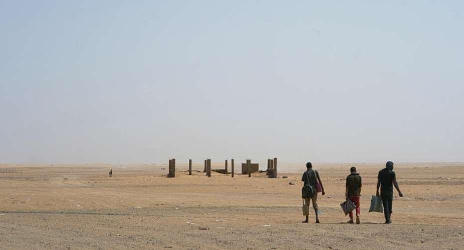 File photo: Three men walk through the desert after crossing the Assamaka border post in northern Niger on June 3, 2018. -  Jerome Delay, AP