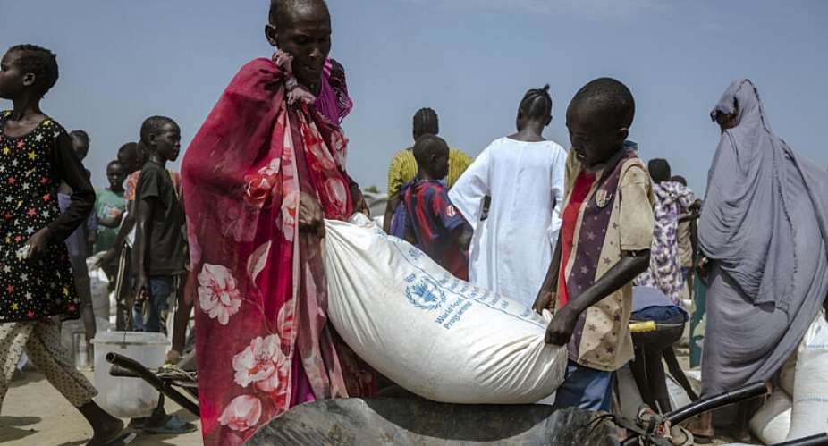 Maize being collected at the Bentiu displaced persons camp in South Sudan. -  Rian Cope, AFP
